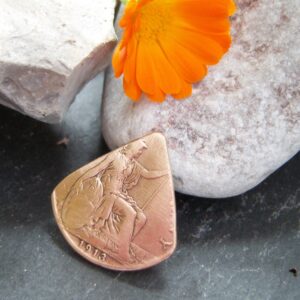 plectrum-made-from-old-penny-coin