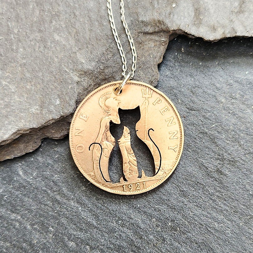 Cat-pendant-pierced-in-penny-coin